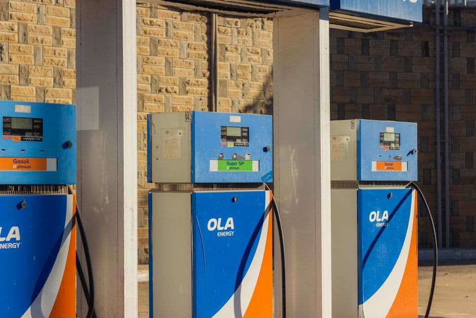 A row of blue diesel and petrol pumps at a filling station.